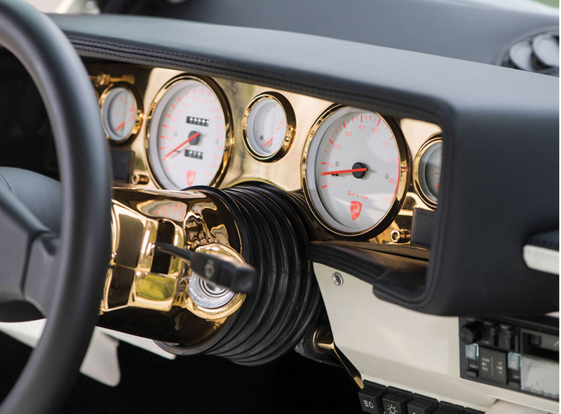 Illustration for article titled I Am Morally Offended By This Gold-Plated Lamborghini Countach Interior